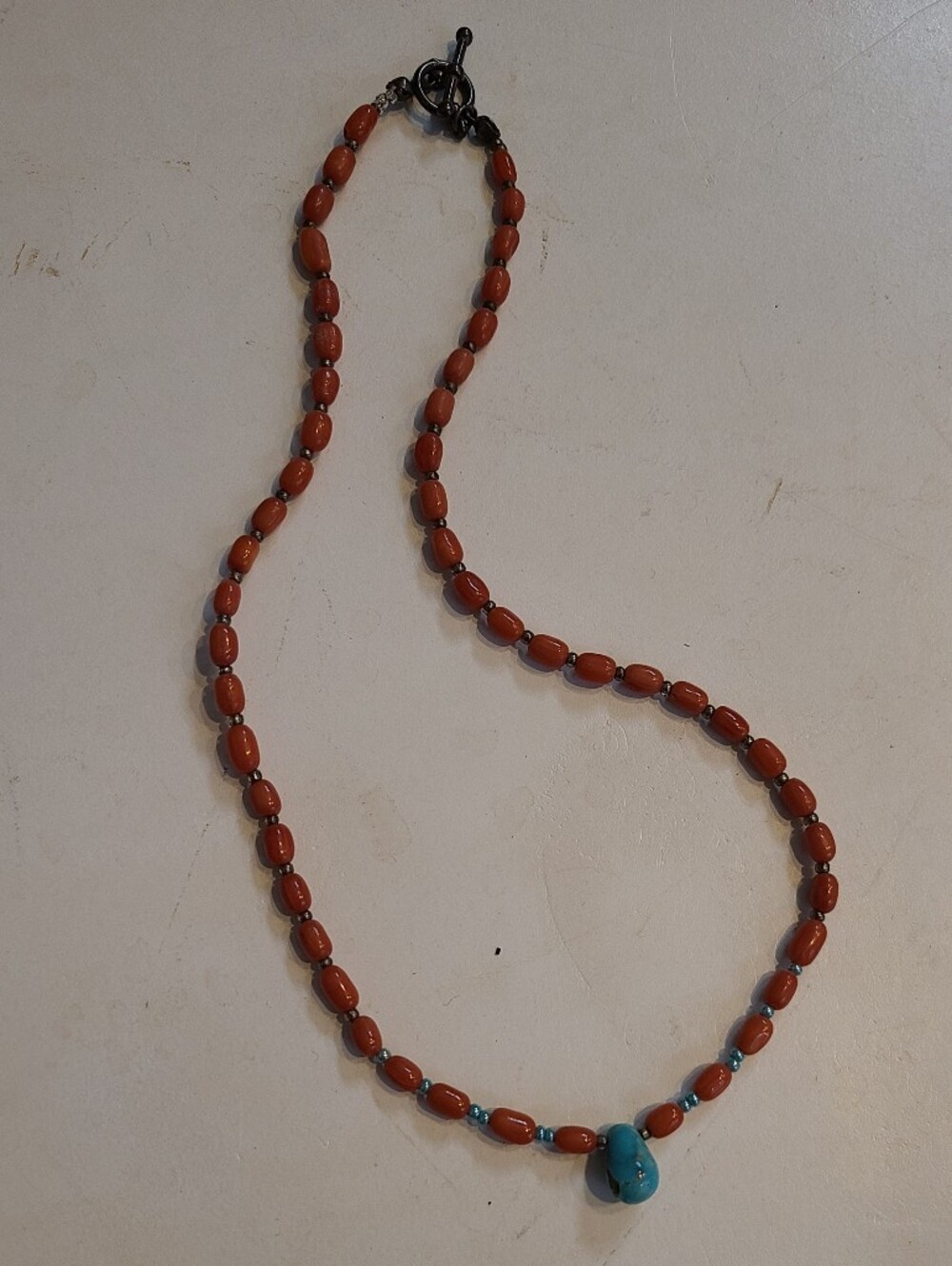 Beaded Coral Colored Necklace with Turquoise Colored Accent